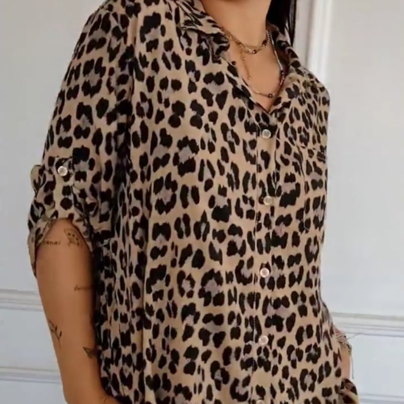Side view of a leopard print blouse showing relaxed cut and lightweight fabric drape