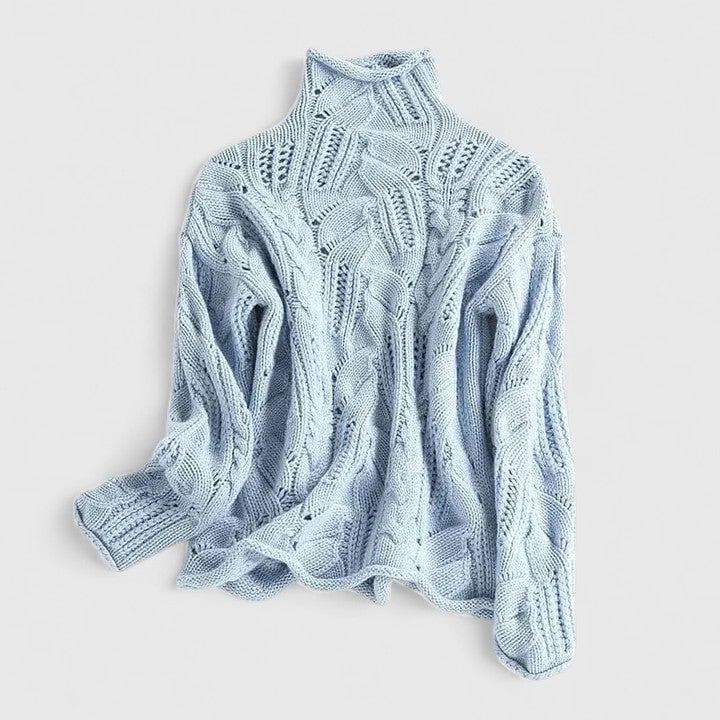 Woman wearing the Charlotte elegant sweater in blue, featuring a soft flattering silhouette
