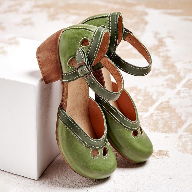 Charlotte orthopedic sandals in orange showing cushioned insole and low heel detail, side view