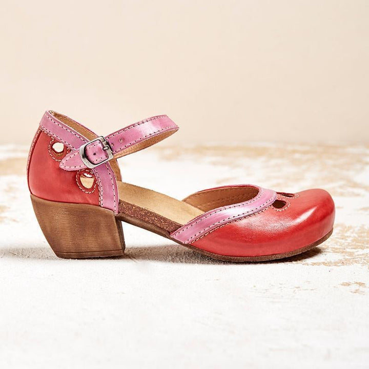 Pair of Charlotte orthopedic sandals in red and orange showing heel height and sole construction