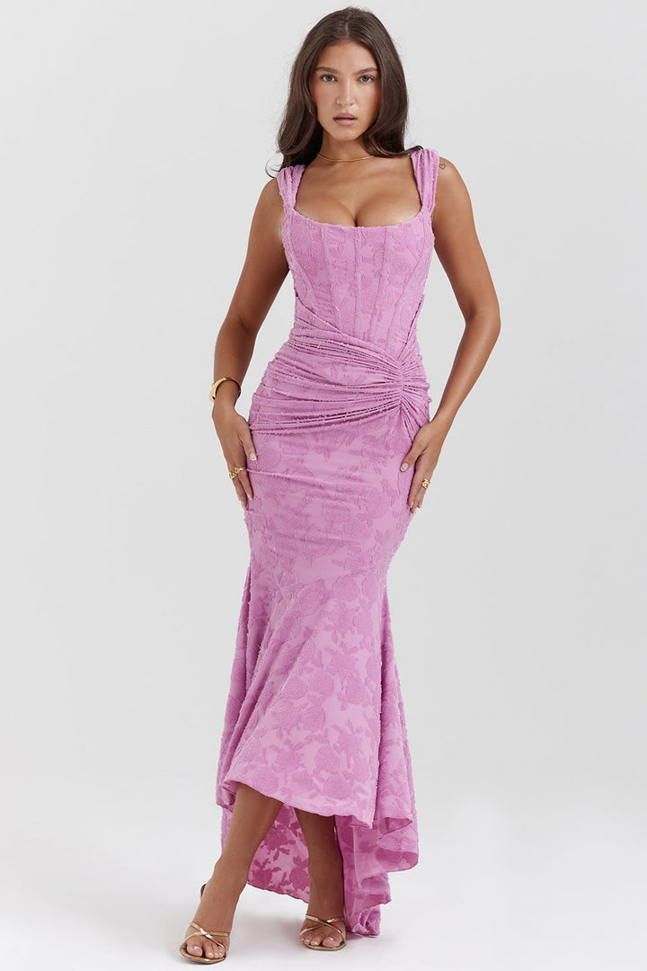 Woman wearing the Charlotte pink ruched bodycon sleeveless evening dress, front view