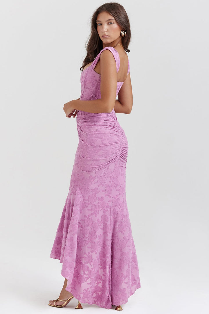 Back view of the Charlotte ruched bodycon dress in beige showing sleeveless silhouette