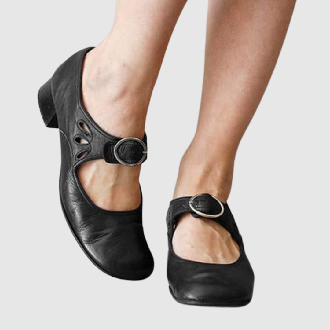 Women's classic Chelsea slip-on boot in black with elastic side panels and cushioned insole, side view
