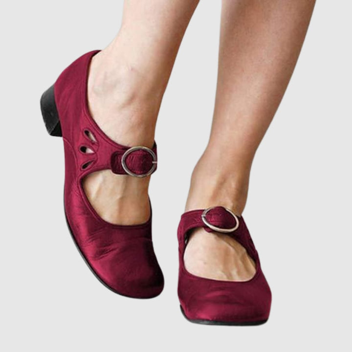 Chelsea boot in red showing streamlined silhouette and elastic side panel detail, front angle