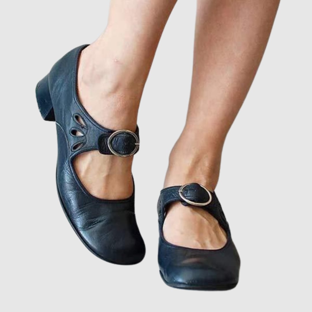 Blue women's Chelsea slip-on boot displayed on neutral background, side profile