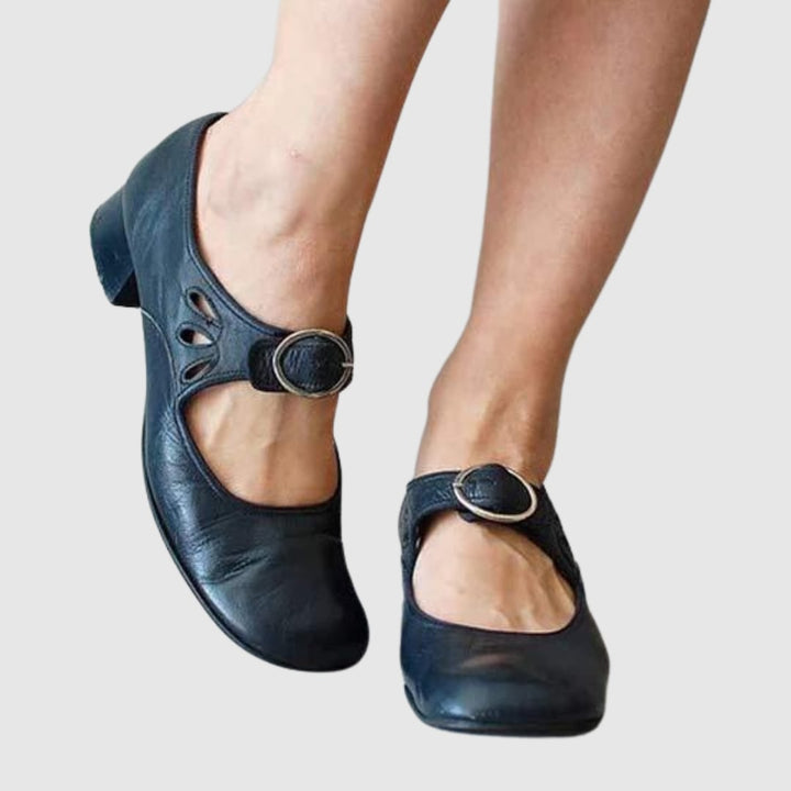 Blue women's Chelsea slip-on boot displayed on neutral background, side profile