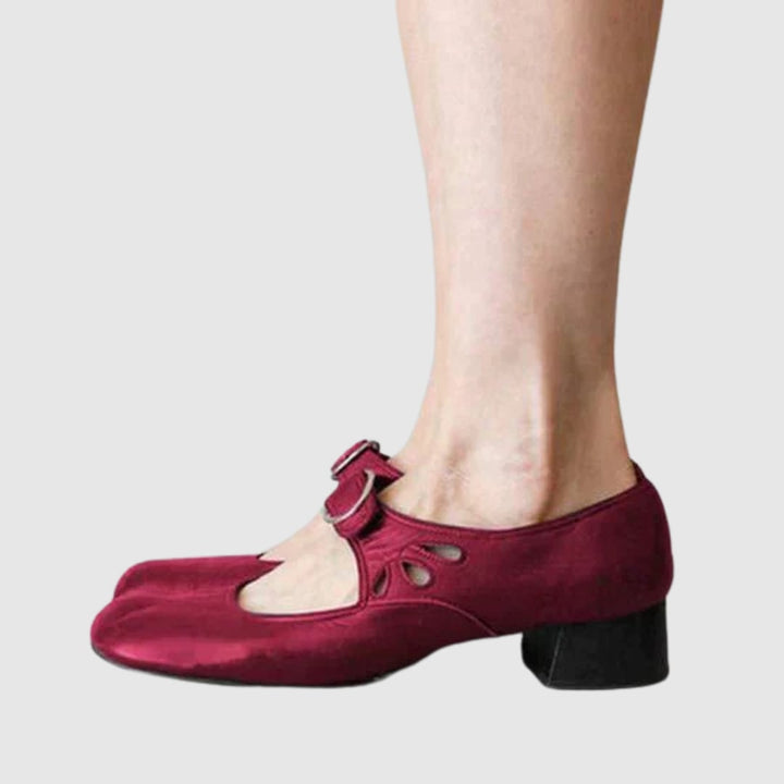 Woman wearing black Chelsea boots with tailored trousers, styled for a smart-casual look