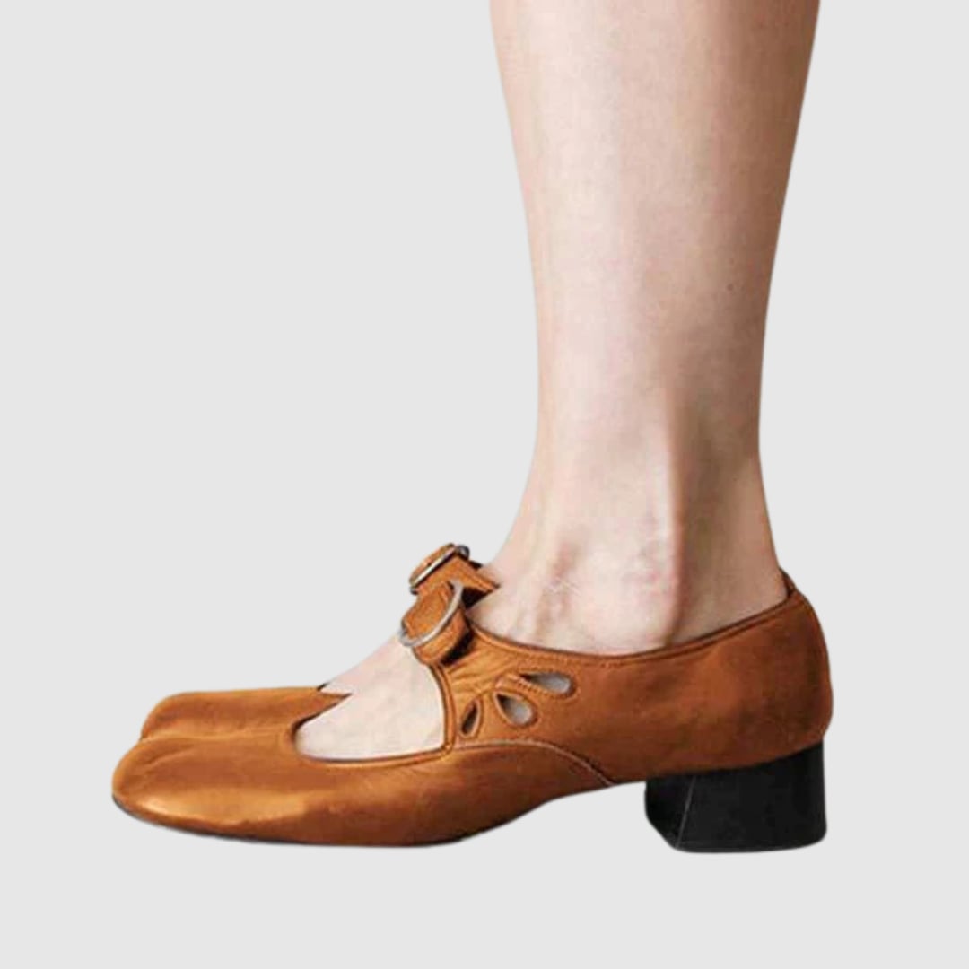 Woman wearing brown Chelsea boots with a midi skirt for an effortless everyday outfit