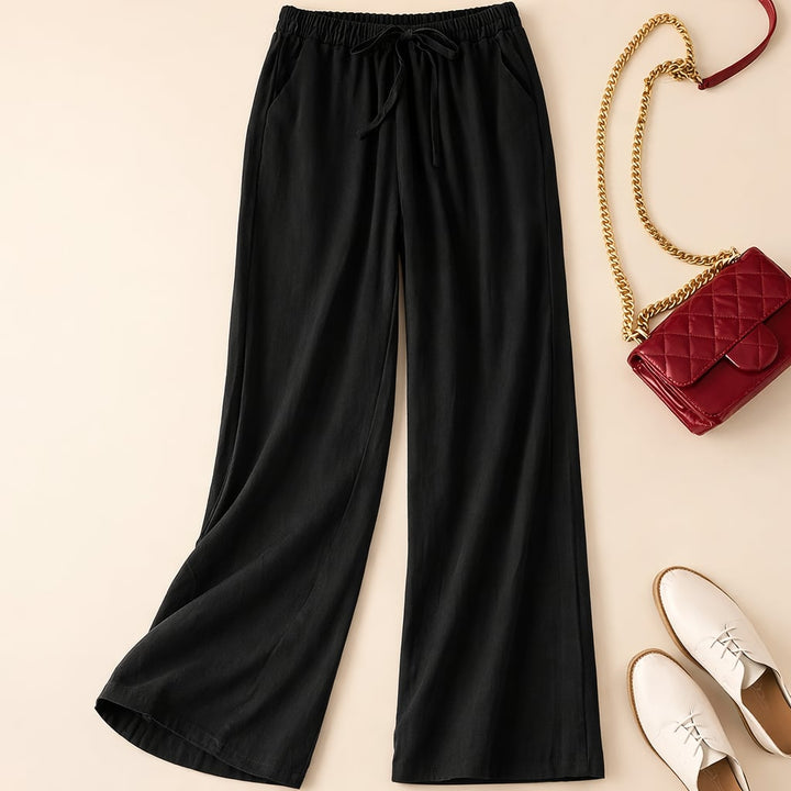Front view of relaxed drawstring pants showing elastic waistband with adjustable tie