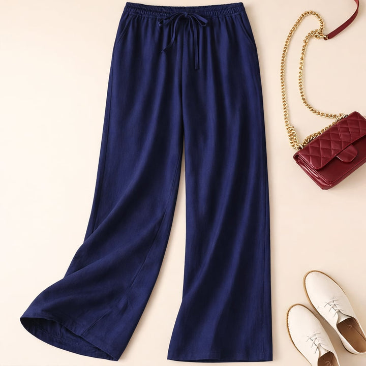 Side profile view of relaxed fit drawstring pants showing soft fabric drape