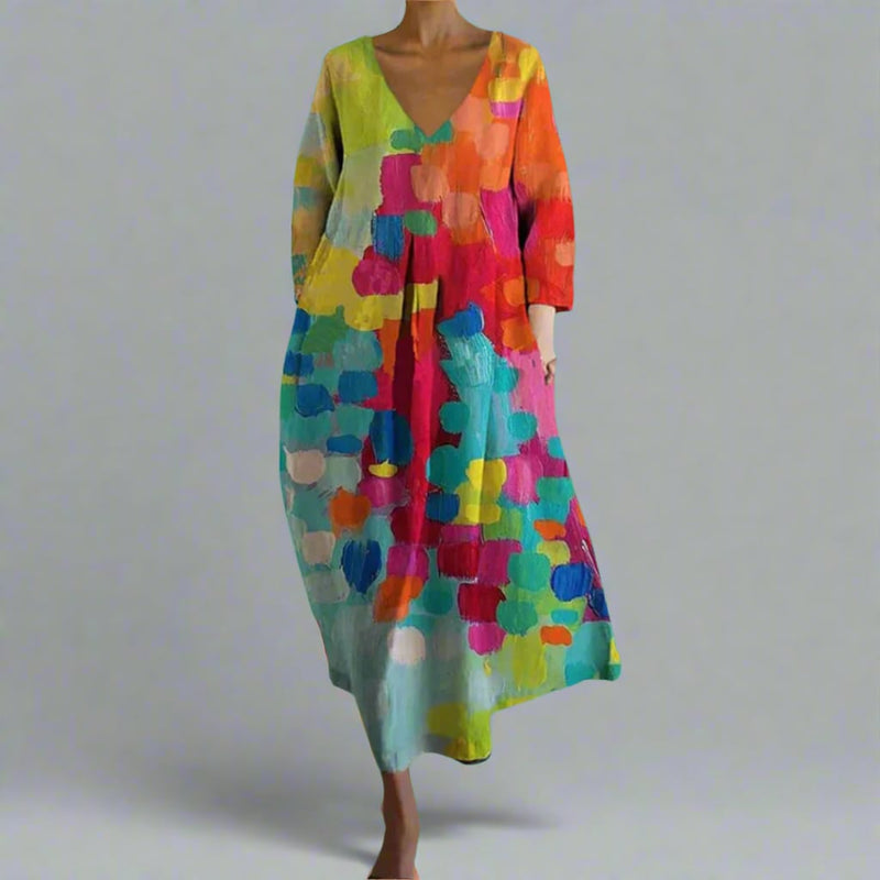 Woman wearing a colorful multicolor all-over print V-neck dress with a relaxed fit