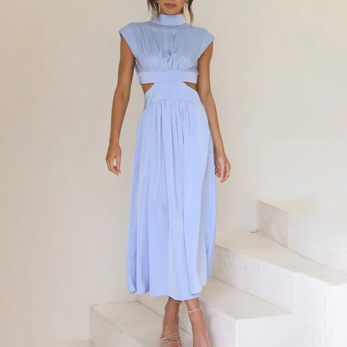 Side profile view of the flowing silhouette of the Florimay halter dress