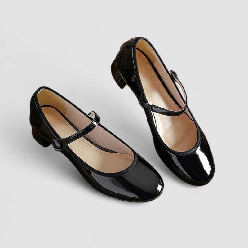 Flat lay of both color options, black and red classic elegant shoes, side by side on a neutral background