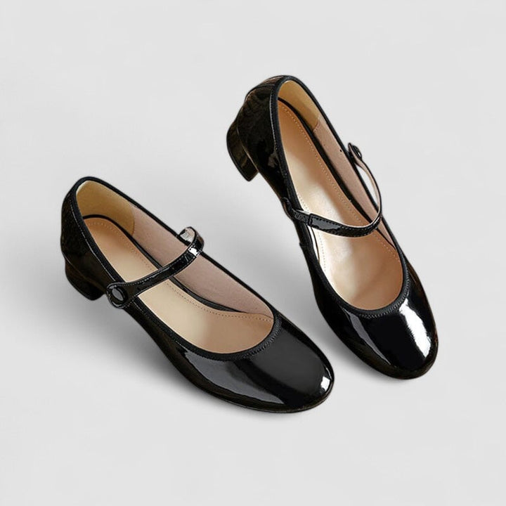 Flat lay of both color options, black and red classic elegant shoes, side by side on a neutral background
