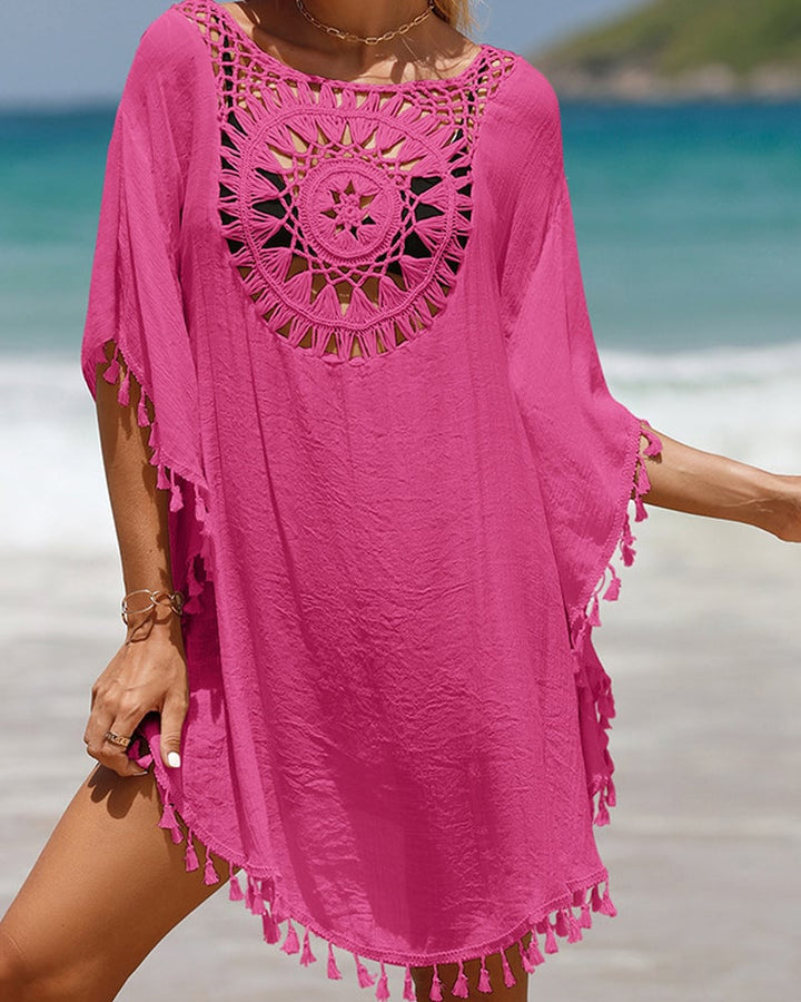 Pink lightweight boho cover-up with crochet pattern draped over a bikini on a sunny day