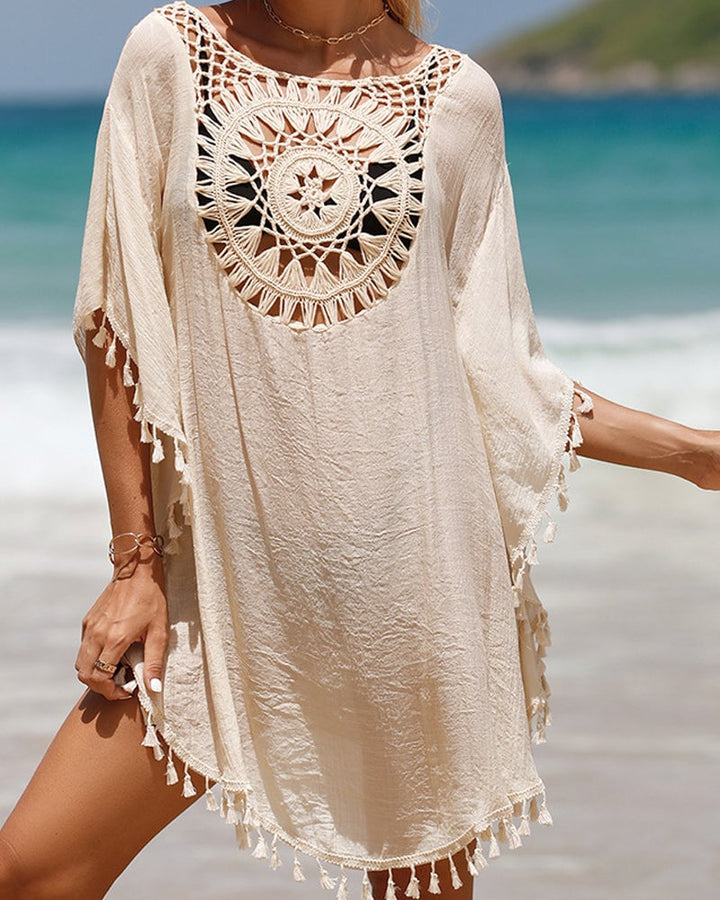 Detail shot of handcrafted crochet-inspired texture on a white boho beach cover-up