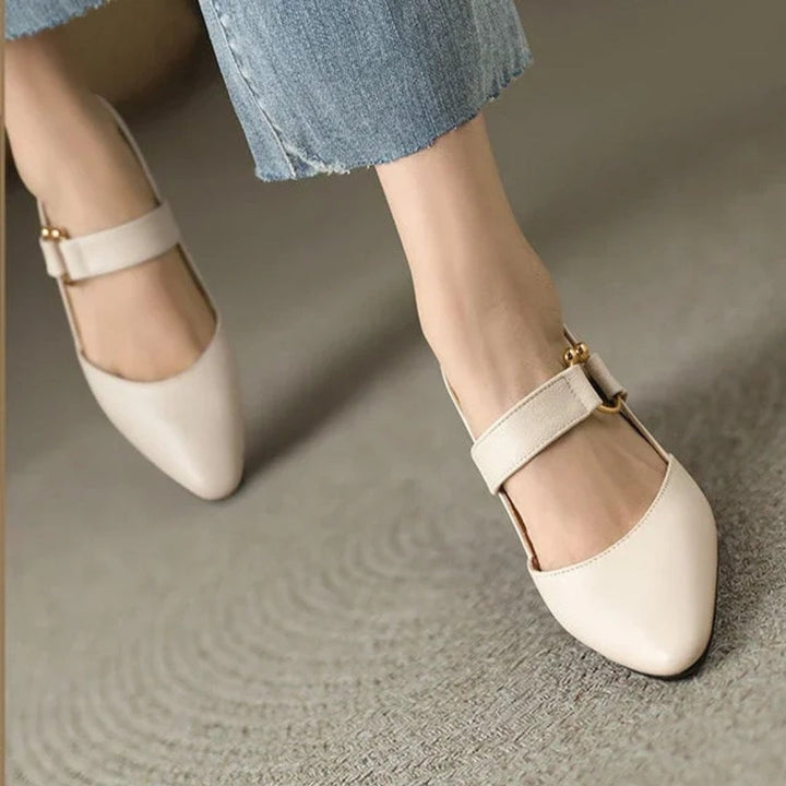Christina orthopedic heels in beige styled with a flowy midi dress on a woman