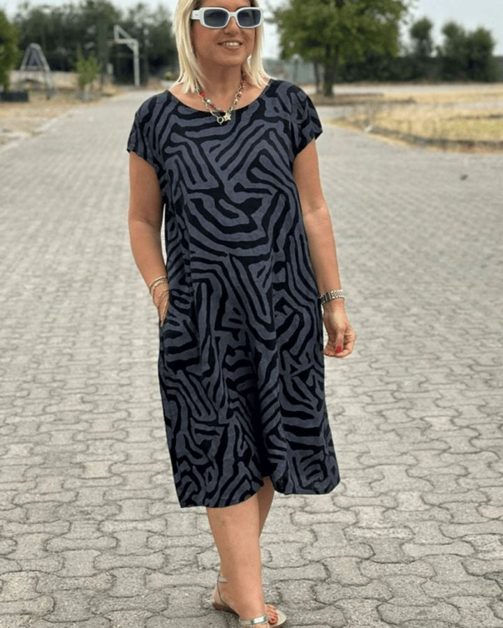 Back view of a lightweight printed summer dress with a round neckline