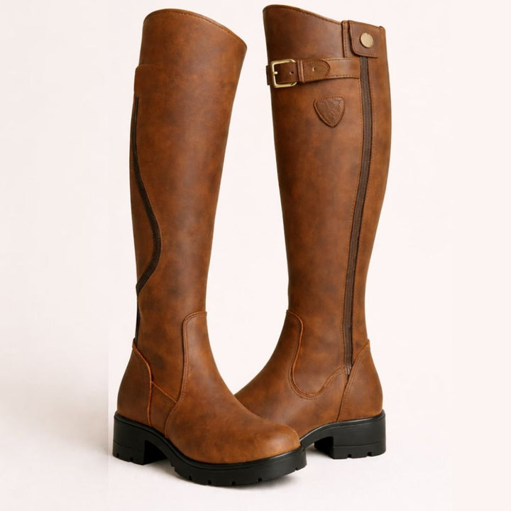 Women's sleek waterproof boots in brown with adjustable closure and slip-resistant sole, styled for everyday wear