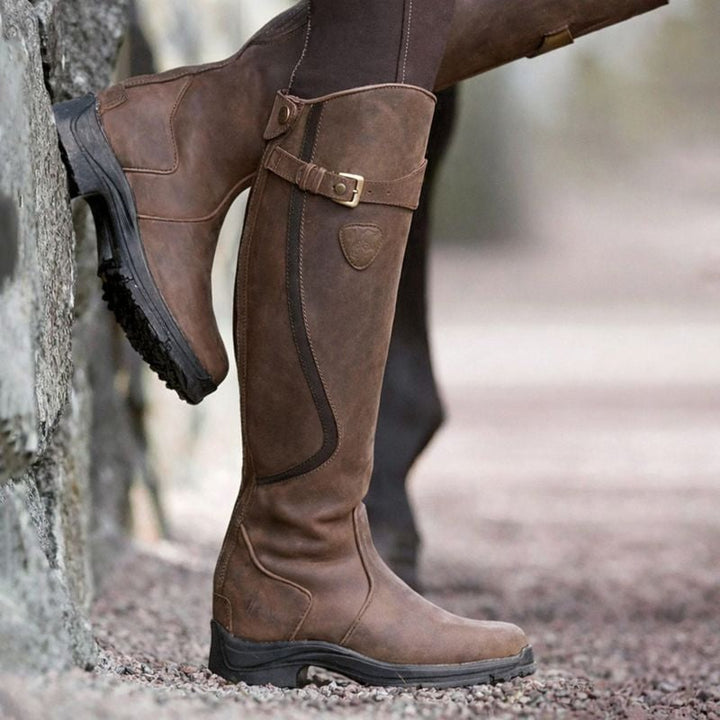 Close-up of Christine waterproof boot showing stretch panel detail and structured silhouette