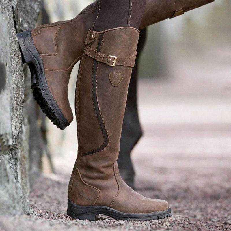 Close-up of Christine waterproof boot showing stretch panel detail and structured silhouette