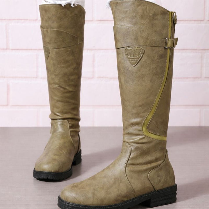 Christine waterproof boots in black paired with straight-leg jeans for a casual city look