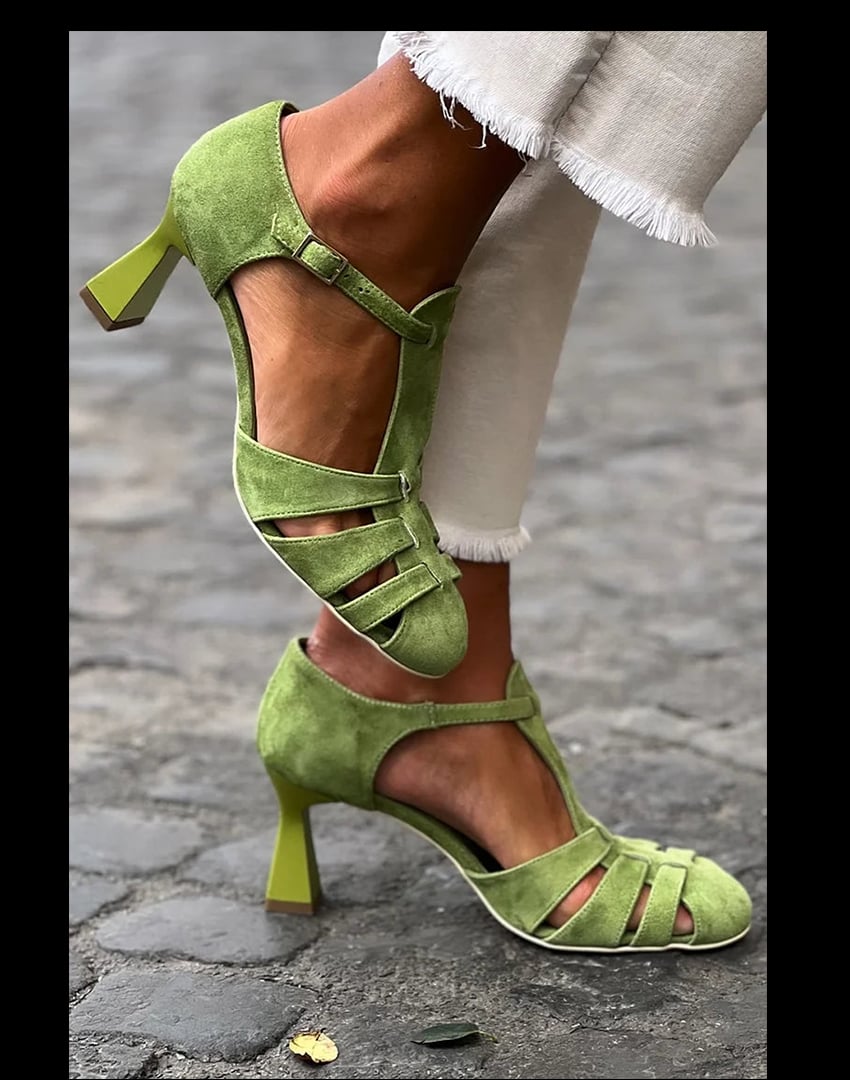 Green vintage strap heels with retro-inspired straps and a cushioned insole, shown from a front three-quarter angle