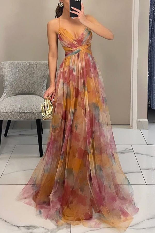 Model in a green floral maxi dress styled with sandals for a casual summer look
