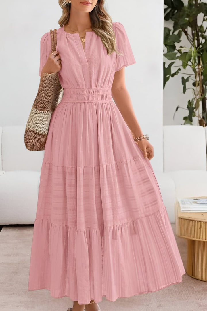 Woman styling the white boho summer dress with sandals and sun hat for a casual look
