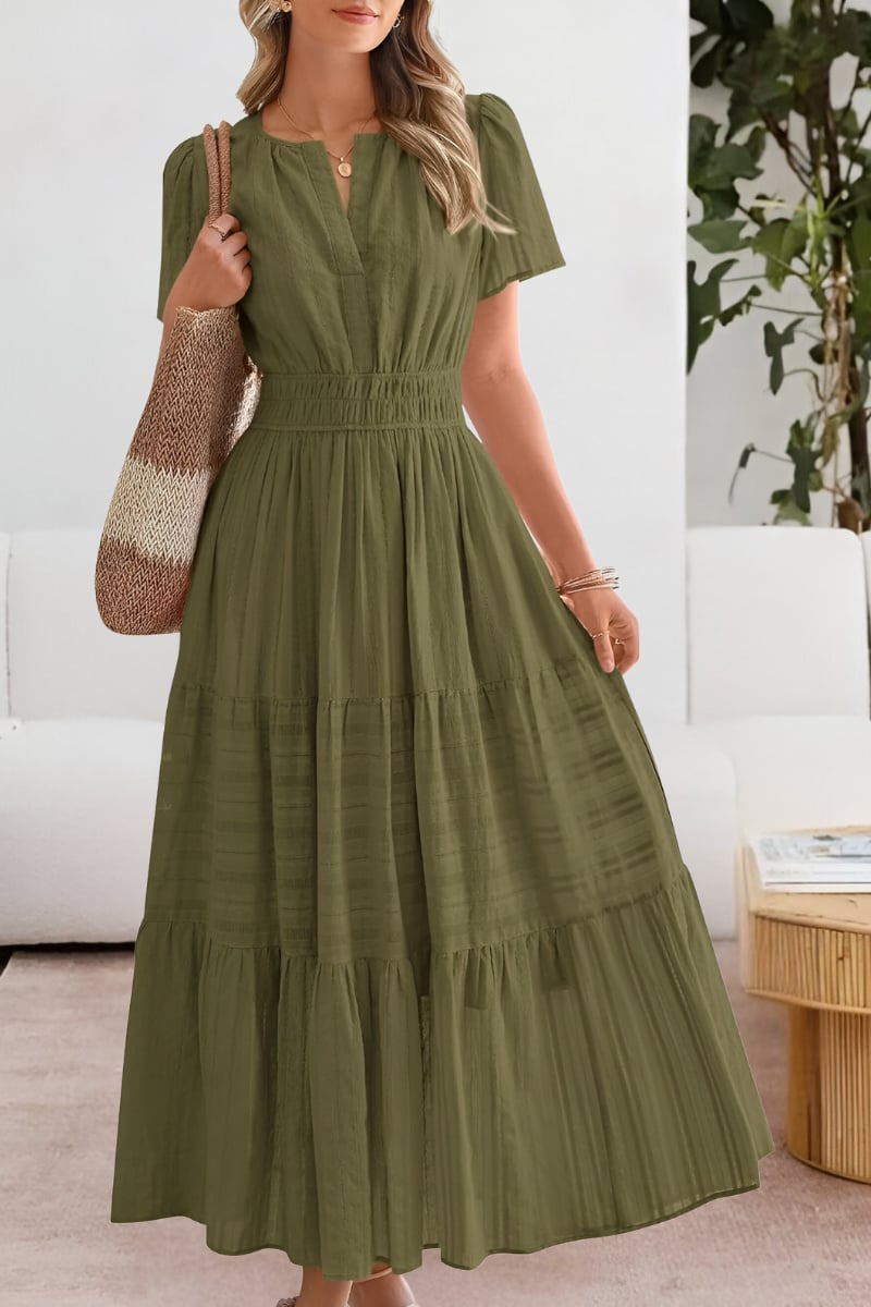 Side view of the flowing pink summer dress highlighting the lightweight fabric movement