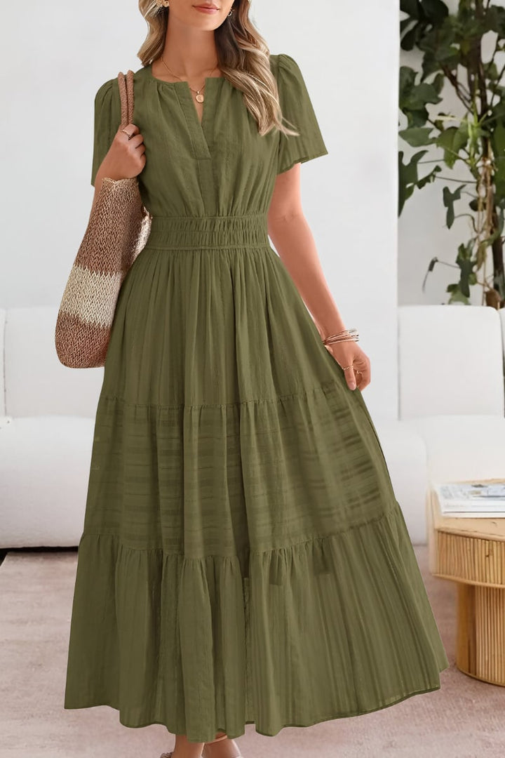 Side view of the flowing pink summer dress highlighting the lightweight fabric movement
