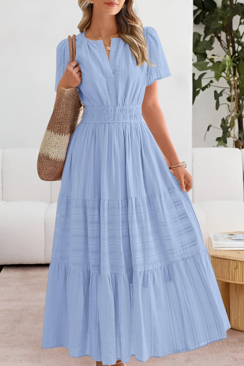 Model wearing the green Boho Breeze dress showing shoulder and length proportions