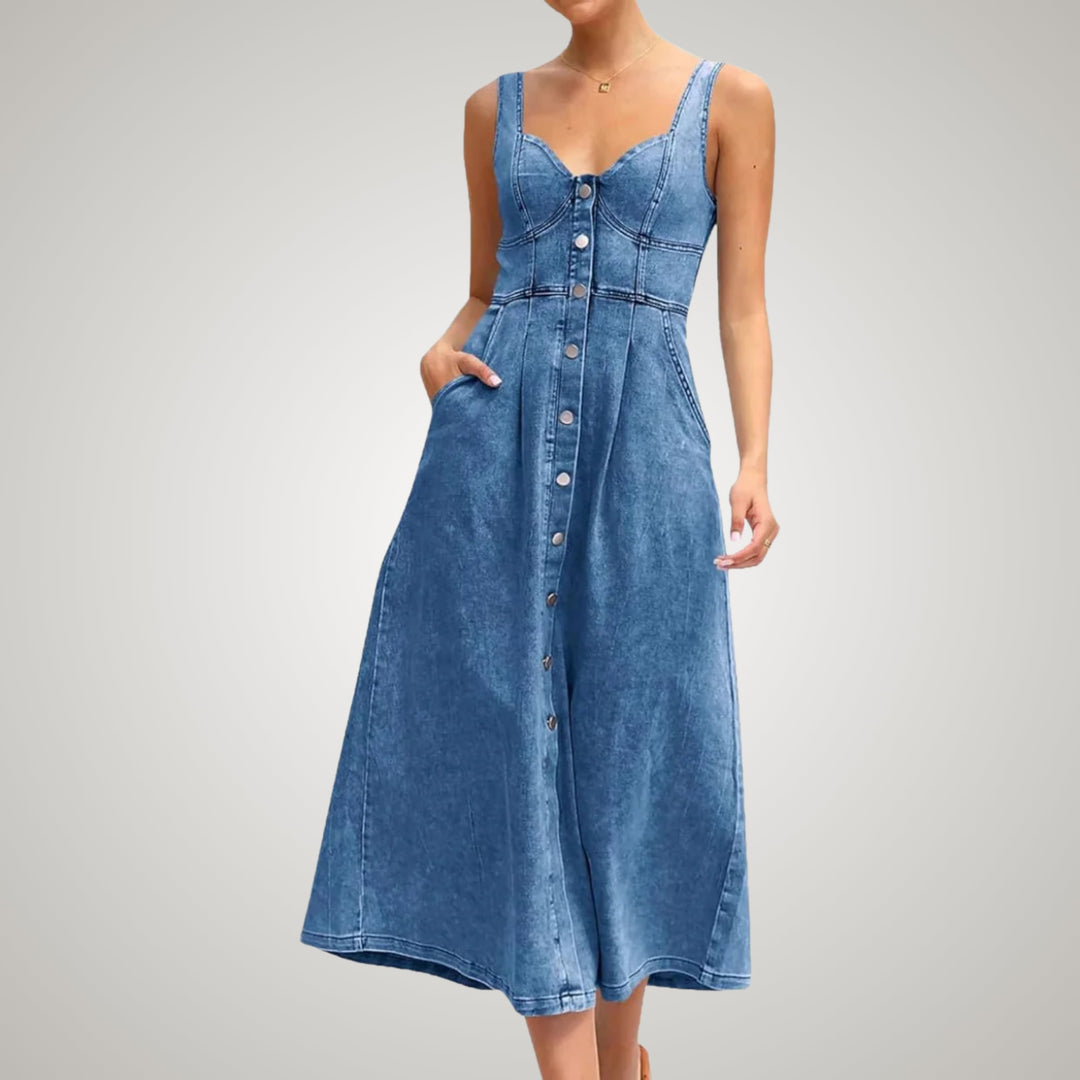 Woman wearing a light blue denim dress layered over a white tee, casual outfit