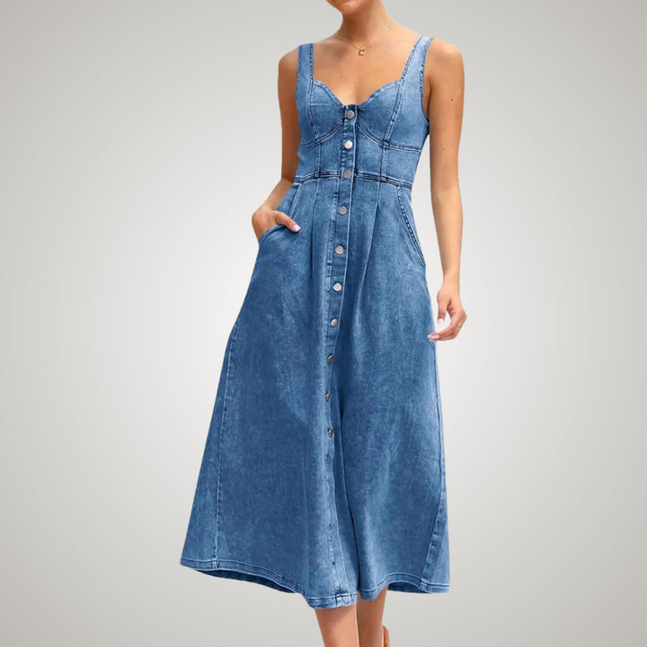 Woman wearing a light blue denim dress layered over a white tee, casual outfit