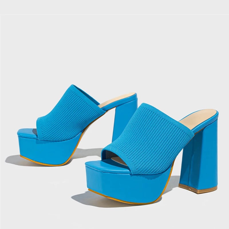Cinnamon platform sandals in orange worn on foot showing fit and heel lift