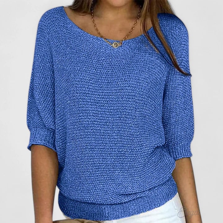 Woman wearing the Claire comfortable sweater in light green with a relaxed, flattering fit