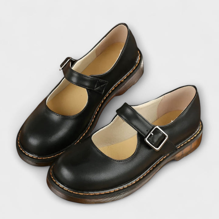 Close-up of Mary Jane flat showing cushioned insole and flexible sole construction