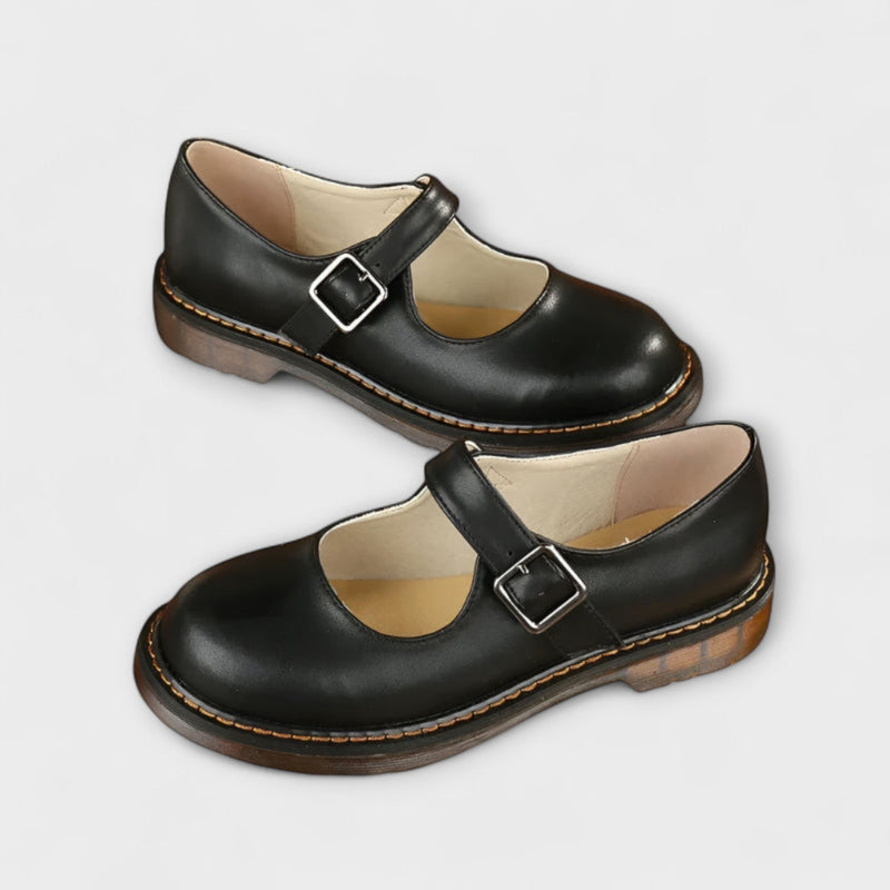 Brown and black Mary Jane flats styled together showing both color options