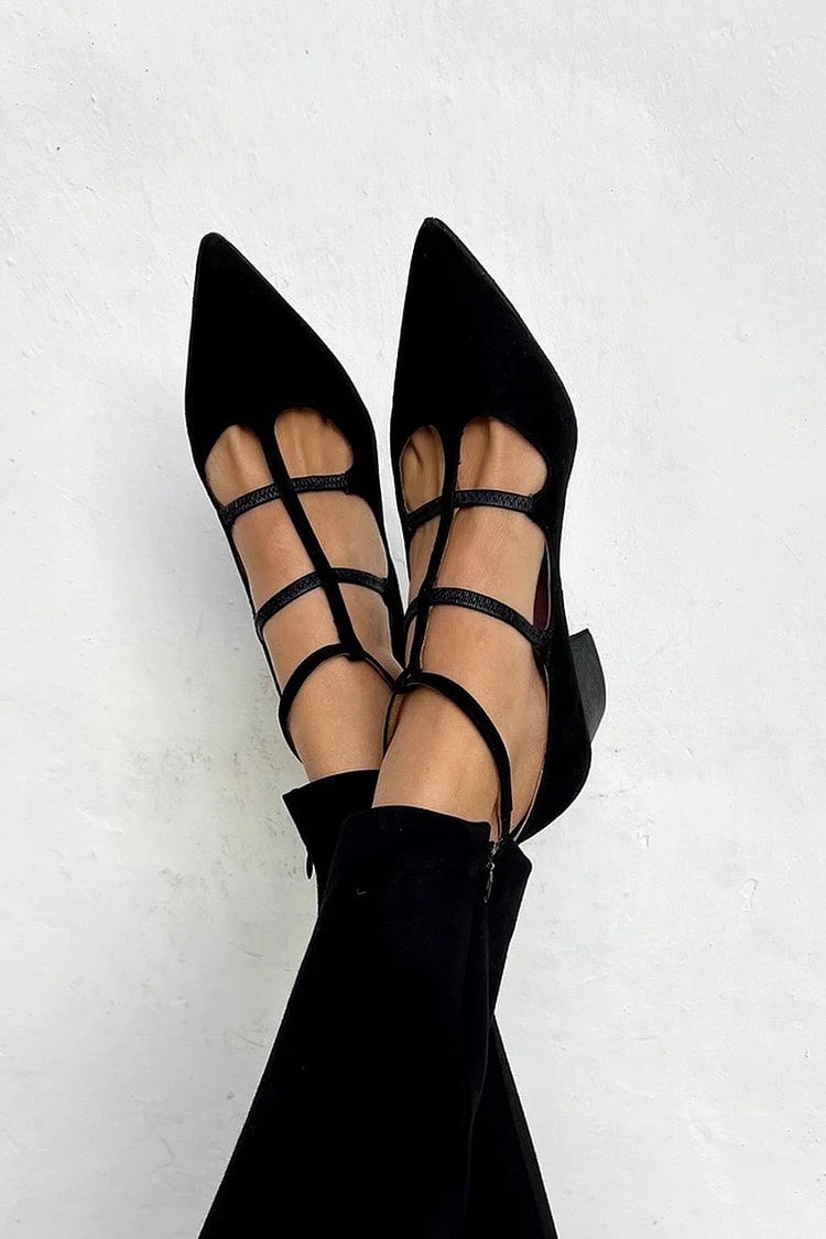Black elegant strappy heels with delicate ankle straps and a sculpted heel, shown against a clean background