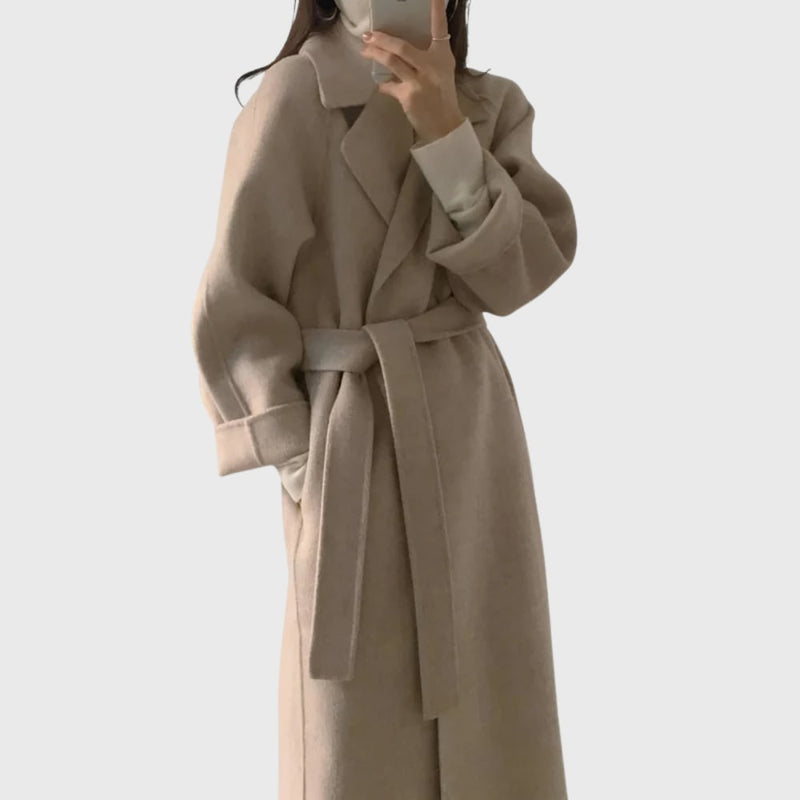 Front view of the Florimay belted overcoat in apricot showing adjustable belt and secure closures