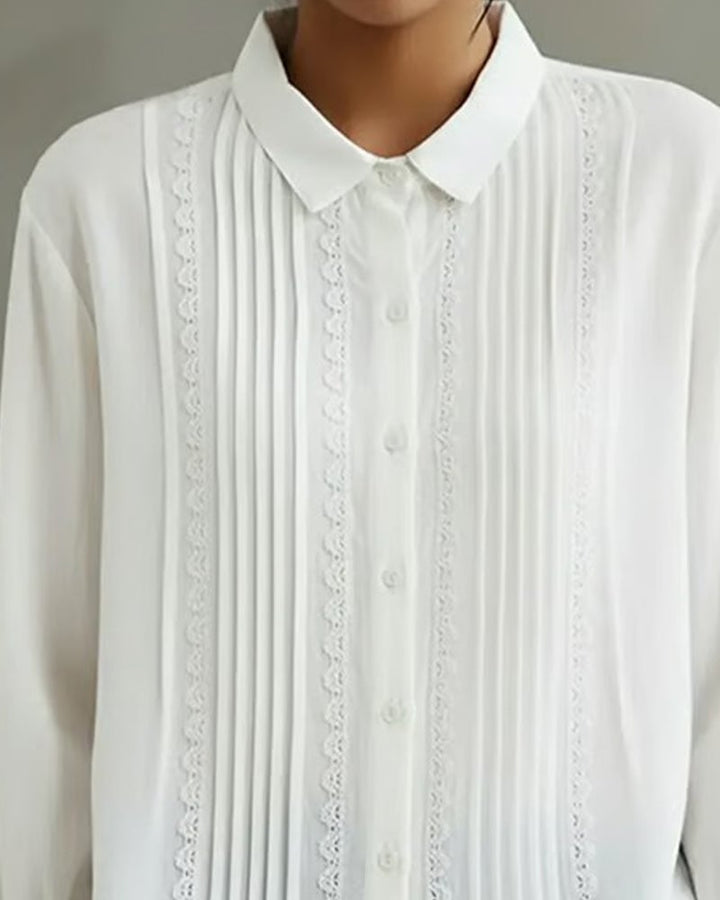 Front detail shot of the knife-pleated panel on the Claire blouse in purple
