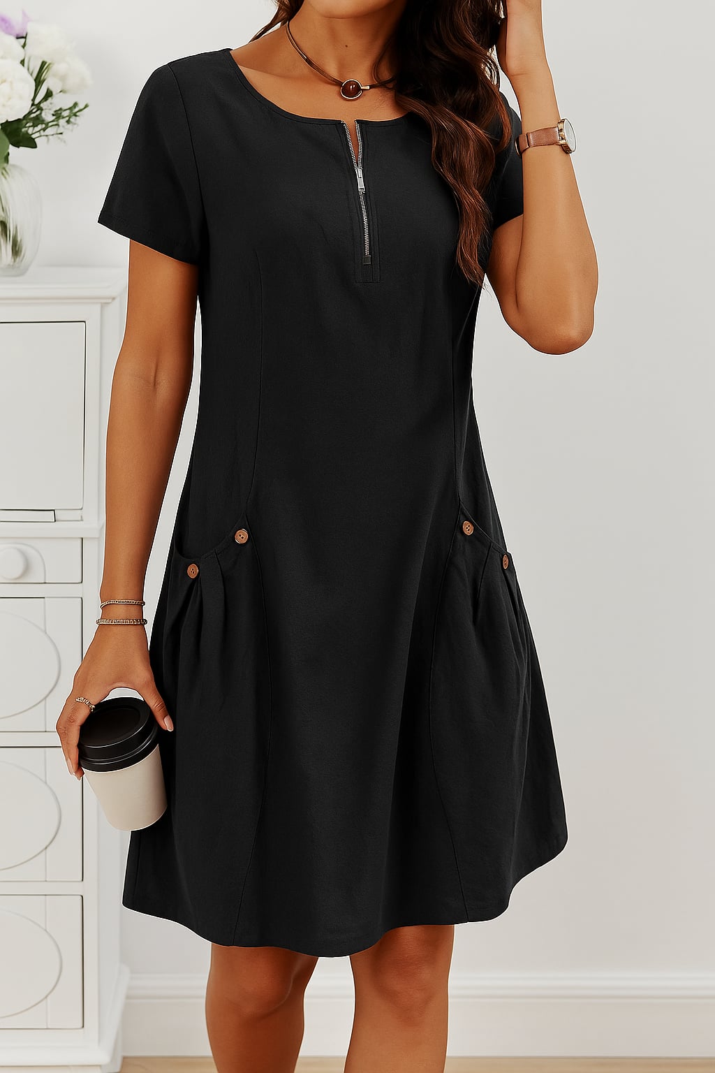 Woman wearing a black lightweight button-front summer dress, dressed down with casual sandals