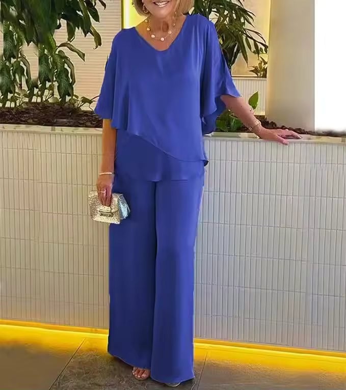 Woman wearing the Clarissa flowing top and wide-leg pants two-piece set in blue, front view