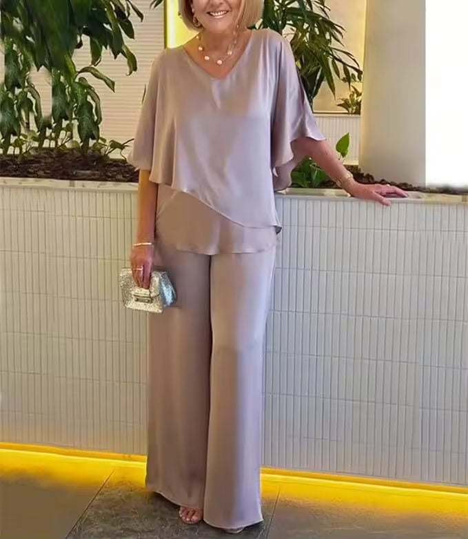 Side view of the Clarissa flowing top and pants set in pink, showing full-length pant style