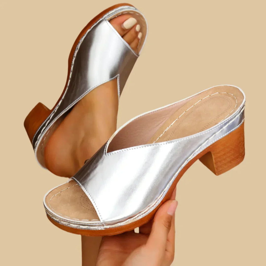 Side view of Claudette orthopedic flat sandals in silver showing contoured support design