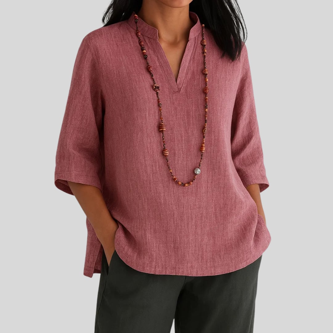 Lifestyle shot of the Claudia blouse showcasing its versatile, effortless warm-weather style