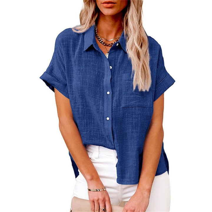 Model wearing the Claudia shirt in White, tucked into high-waisted trousers