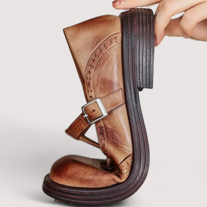 Claudia Mary Jane shoes in brown shown on a flat surface, top-down view highlighting the strap detail