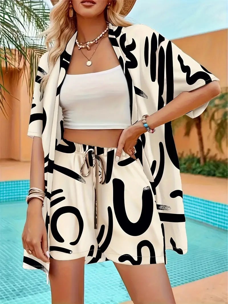 Woman wearing black floral kimono cardigan and matching shorts set