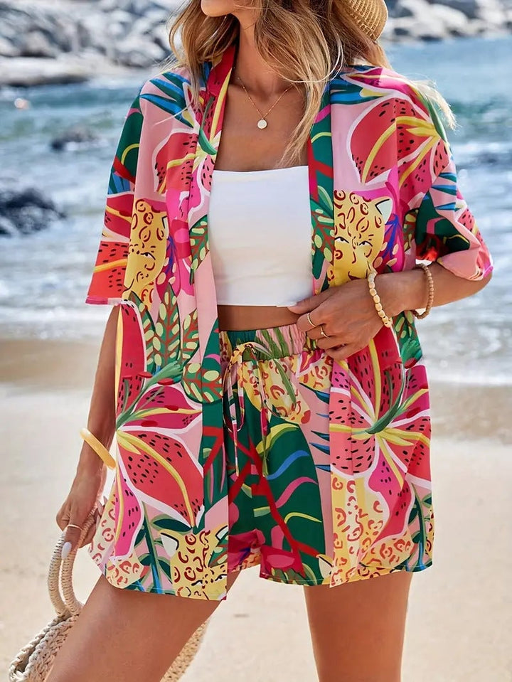 Model wearing blue floral kimono set styled with open cardigan draped over shoulders
